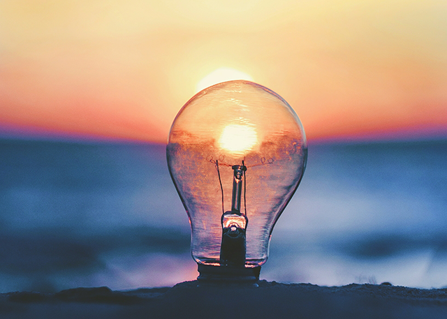 An image of a lightbulb shows the need for consumer insights to achieve company goals